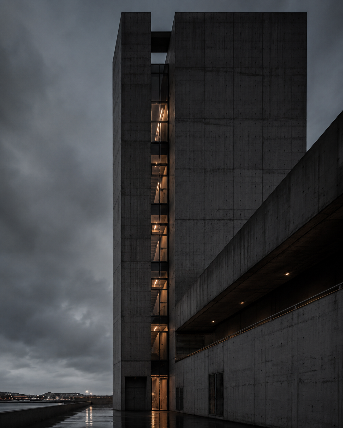 Tall concrete building with illuminated windows